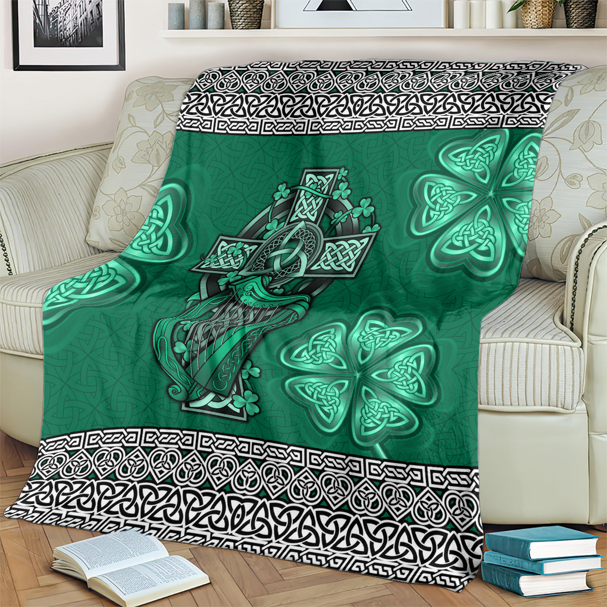 Green Celtic blanket spread on bed, harp and shamrock designs with patterned black border