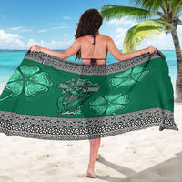 Green sarong featuring Celtic cross and harp with shamrock clover motif border.
