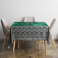 Green dining tablecloth featuring Celtic motifs: cross, harp, shamrock with patterned trim