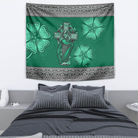 Green tapestry featuring Celtic cross-and-harp with four shamrocks and patterned border