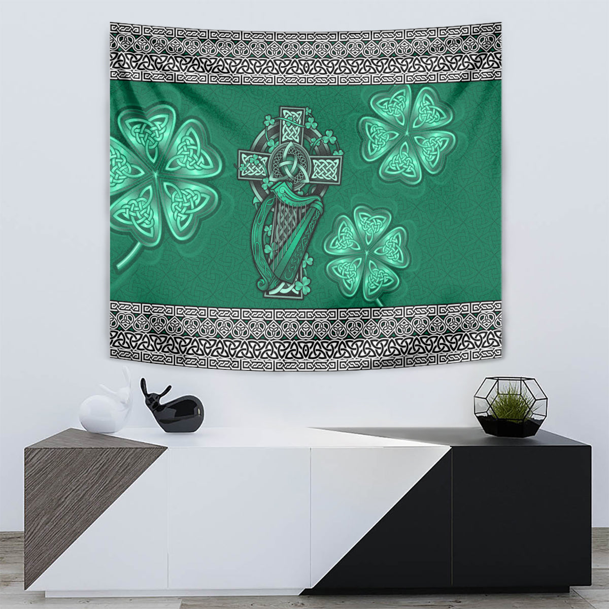 Green Celtic tapestry with cross-and-harp figure, surrounding shamrocks, and black border