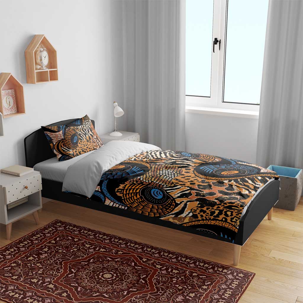 Animal motif bedding set on bed with zebra and leopard prints in blue, orange, and black
