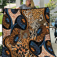 Black Ankara-style quilt with mixed animal print and blue, orange circular motifs