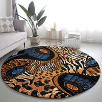 Round patterned carpet with animal print medallions in blue, orange, and black