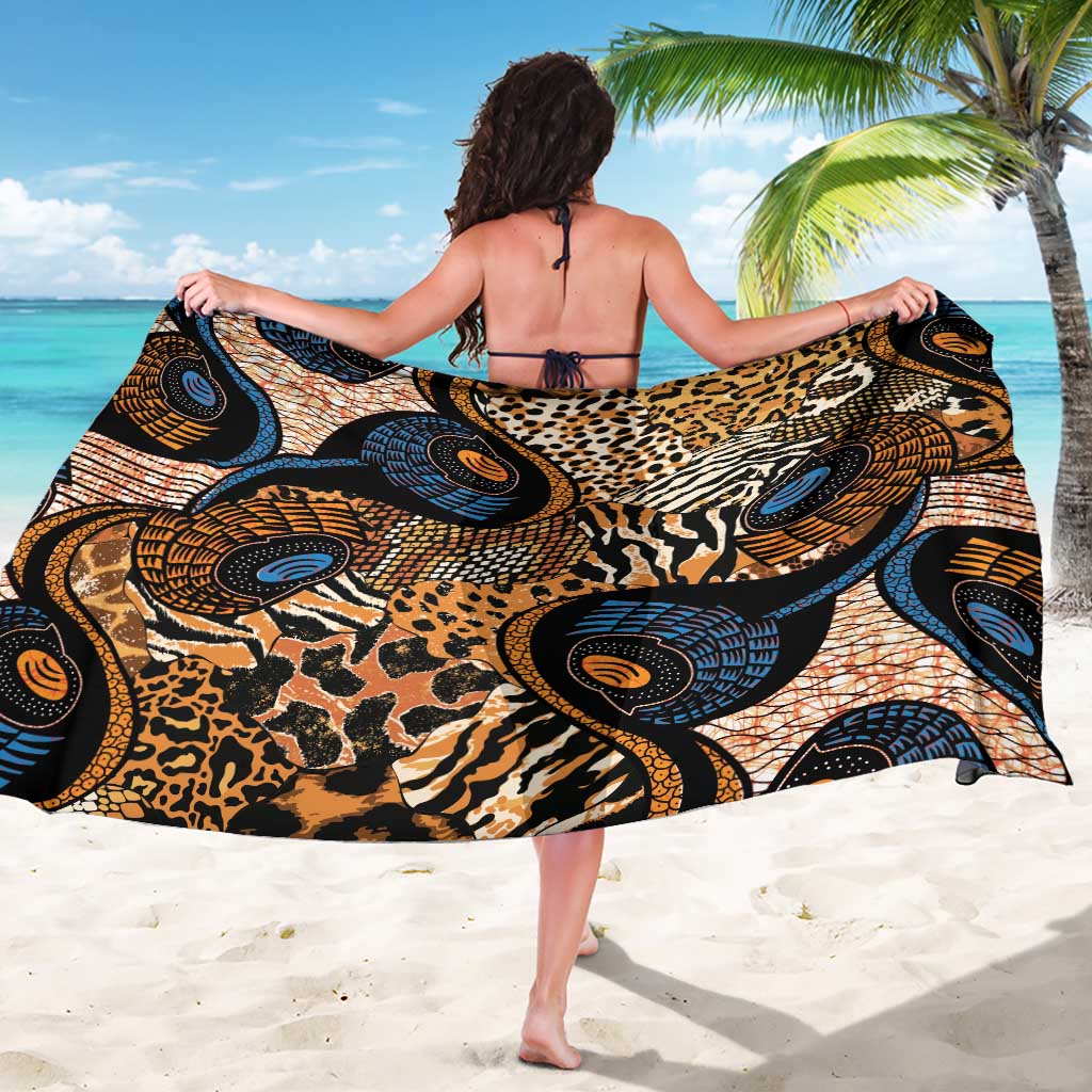 Black animal-print sarong with circular motif panels, worn as a wrap skirt