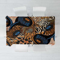 Animal-skin patterned tablecloth with black, tan, and blue abstract motifs