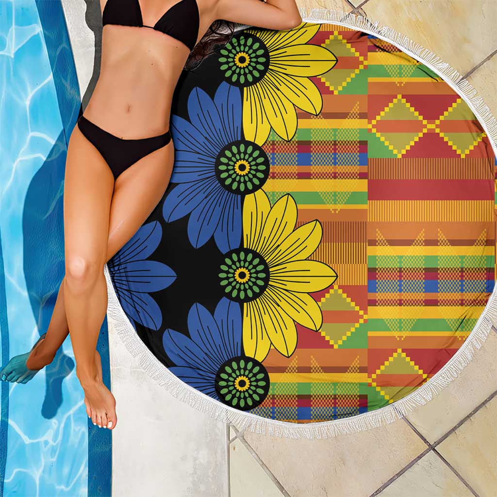 150cm round beach blanket by pool, black base with large blue yellow flowers and fringe
