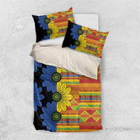 Black kitenge-style duvet set with blue and yellow flower print and multicolor patchwork