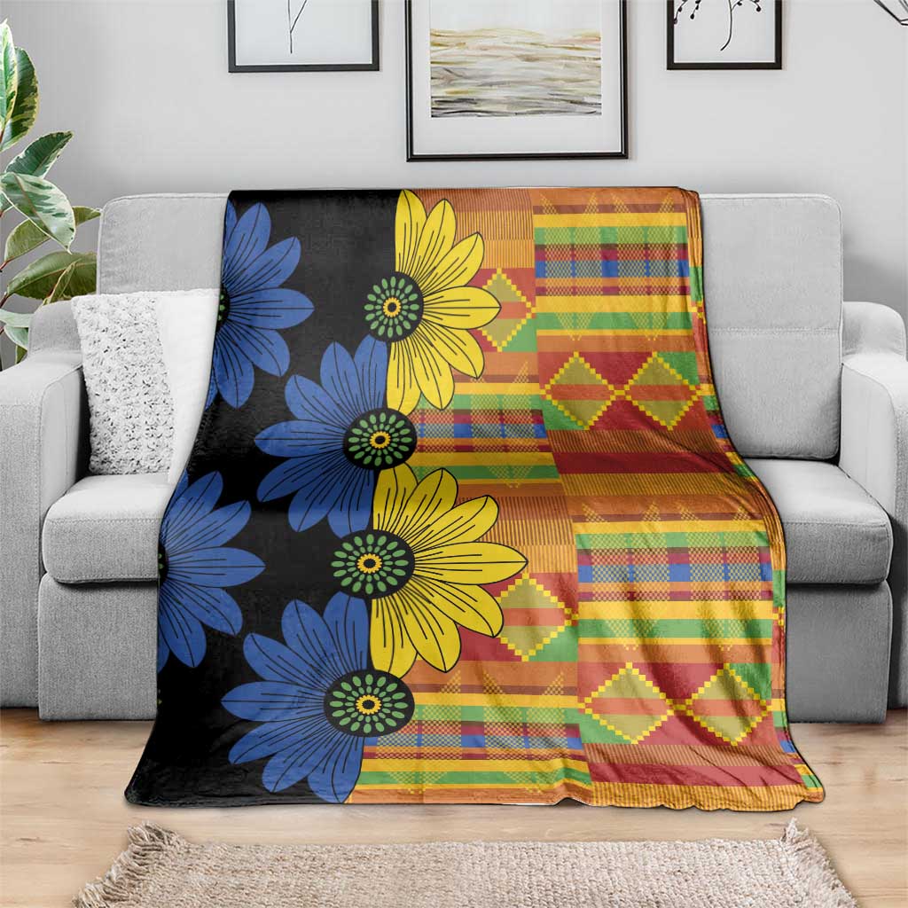 Floral ethnic throw blanket with blue and yellow flowers and multicolor plaid and diamond blocks