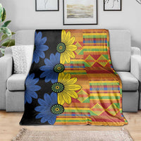 Floral ethnic throw blanket with blue and yellow flowers and multicolor plaid and diamond blocks