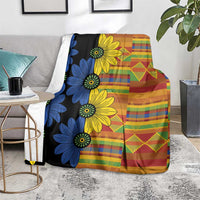 Flower print kitenge-style blanket in black with multicolor plaid, stripes, and diamond motifs