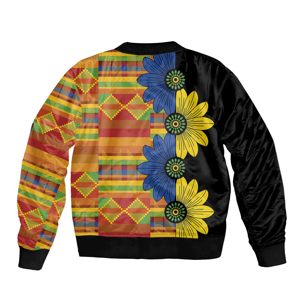 Unisex black bomber jacket with colorful patchwork back and large blue/yellow floral print