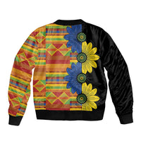 Unisex black bomber jacket with colorful patchwork back and large blue/yellow floral print