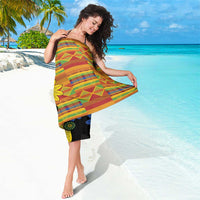 Black kitenge-style sarong wrap dress, multicolor woven check stripes and large flower medallions