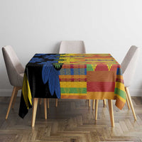 Kitenge-style tablecloth on table, navy floral print with red-green plaid pattern