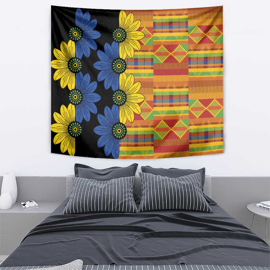 Black wall tapestry with blue and yellow daisy flowers and orange multicolor geometric patchwork