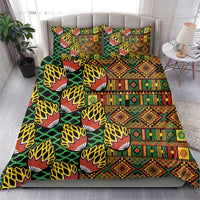 Kanga bedding set featuring green leaf-and-fan motifs and colorful geometric stripe panels