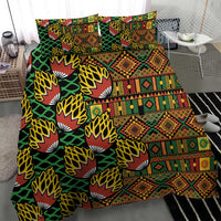 Kanga bedding set with green leaf motif and multicolor geometric banded pattern