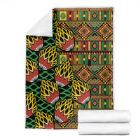 Multicolor kanga blanket with dense geometric paneling and stylized fan motifs