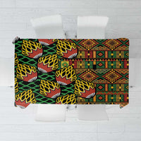 African tribal geometric kanga tablecloth with black, green, red, and yellow patterns