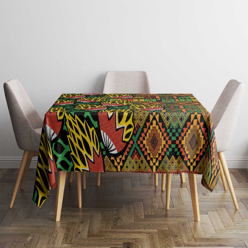 African tribal kanga tablecloth in green, red, and yellow geometric print on table