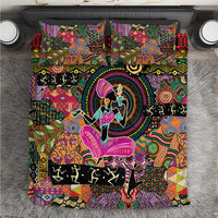 Bedding set with multicolor tribal motifs and central dancer silhouette on dark background