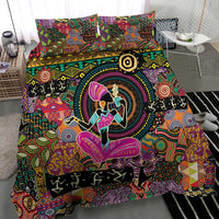 Bedding set featuring bold tribal motifs, circular emblem, and dancer artwork on dark fabric