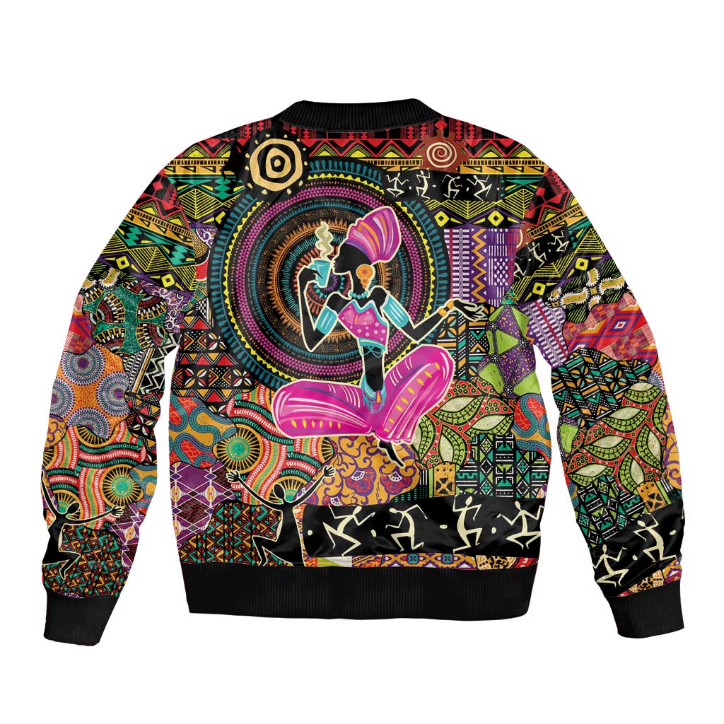 Black bomber jacket with large back graphic of African woman figure, ribbed hem and cuffs