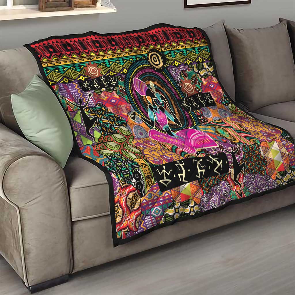 Black throw quilt on beige sofa with colorful circular artwork and purple butterfly design