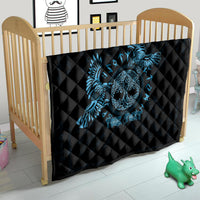 Black quilt with blue raven skull design for a baby bed, quilted diamond stitching