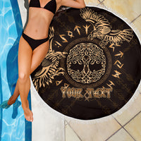 Circular beach blanket in black with gold raven Celtic crest, 'YOUR TEXT' fringe border