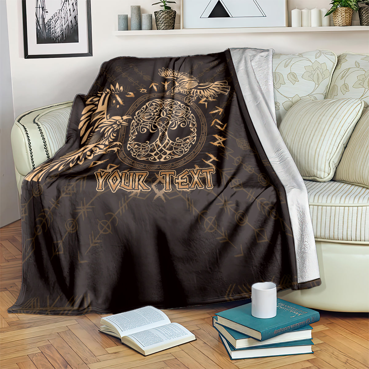 Personalized black blanket with gold Celtic raven and custom text, draped on sofa