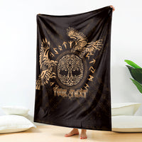 Personalized black blanket with gold raven artwork and 'Your Text', draped as a wall