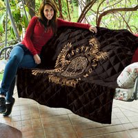 Black quilt with gold Celtic raven skull print and diamond quilting, shown laid out with 'Your Text'.