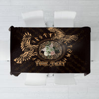 Personalized tablecloth, black with gold raven and Celtic pattern, folded on display