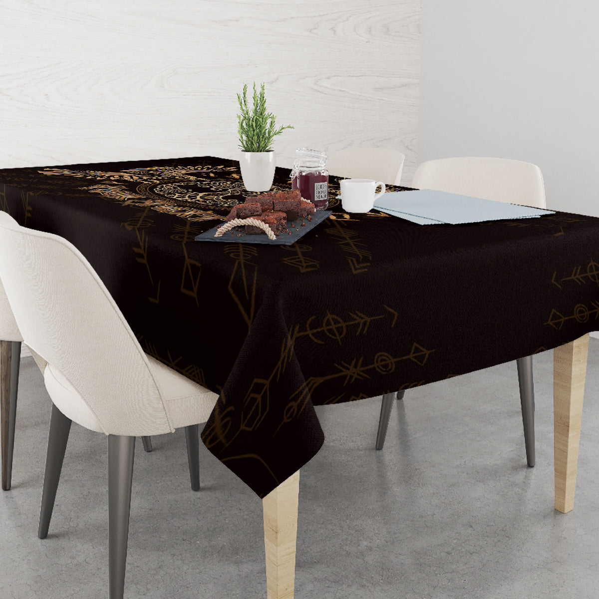 Personalized black tablecloth with gold raven and circular Celtic emblem, draped to floor