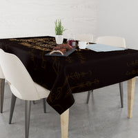 Personalized black tablecloth with gold raven and circular Celtic emblem, draped to floor