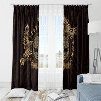 Dark window curtains with gold Celtic raven motif around sheer window panel