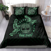 Black duvet cover and two green Celtic raven pillowcases on a bed
