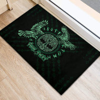 Black rubber doormat with green Celtic raven emblem, rune pattern, and side motifs