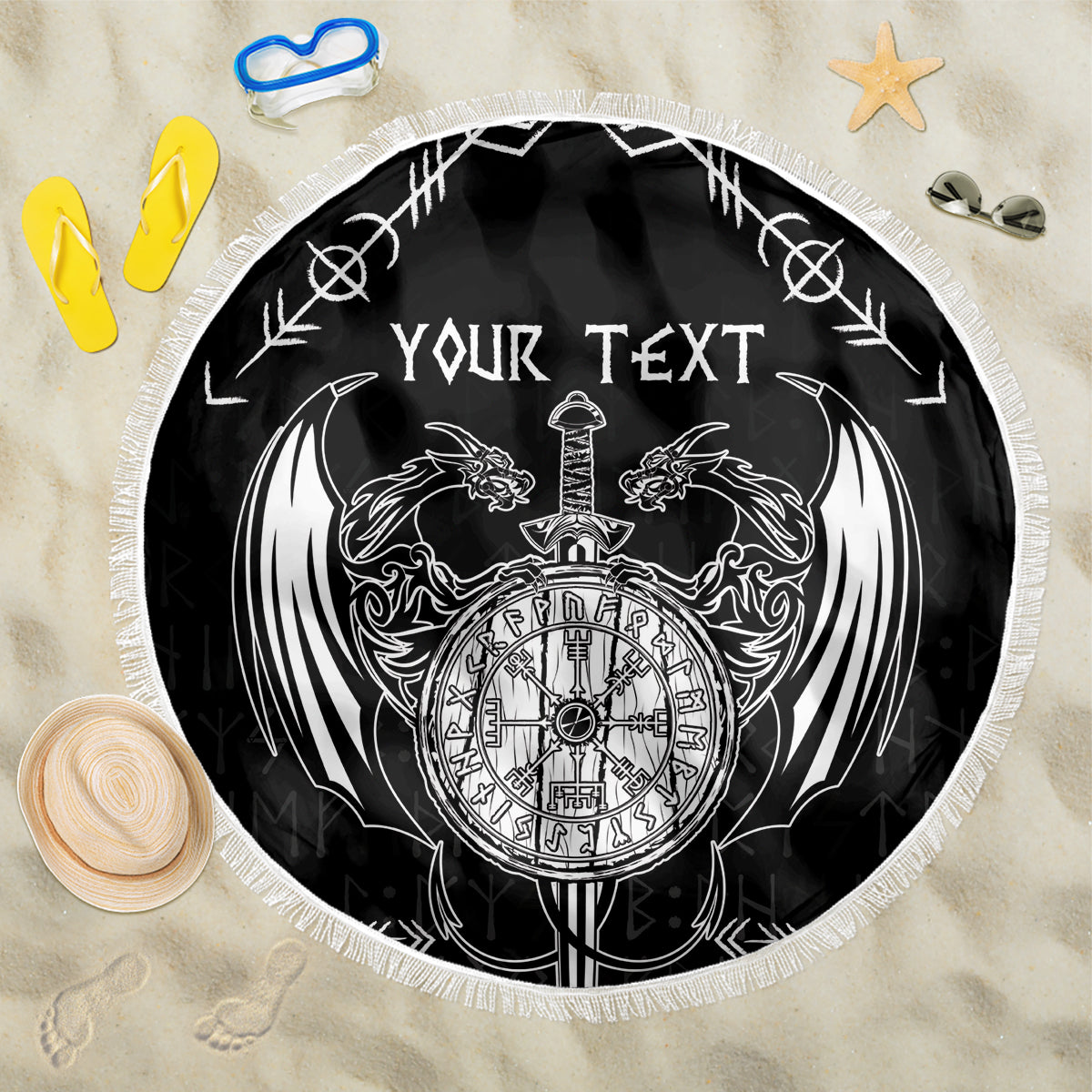 Black round beach blanket with white dragon crest, sword, and 'YOUR TEXT' print, fringe edge