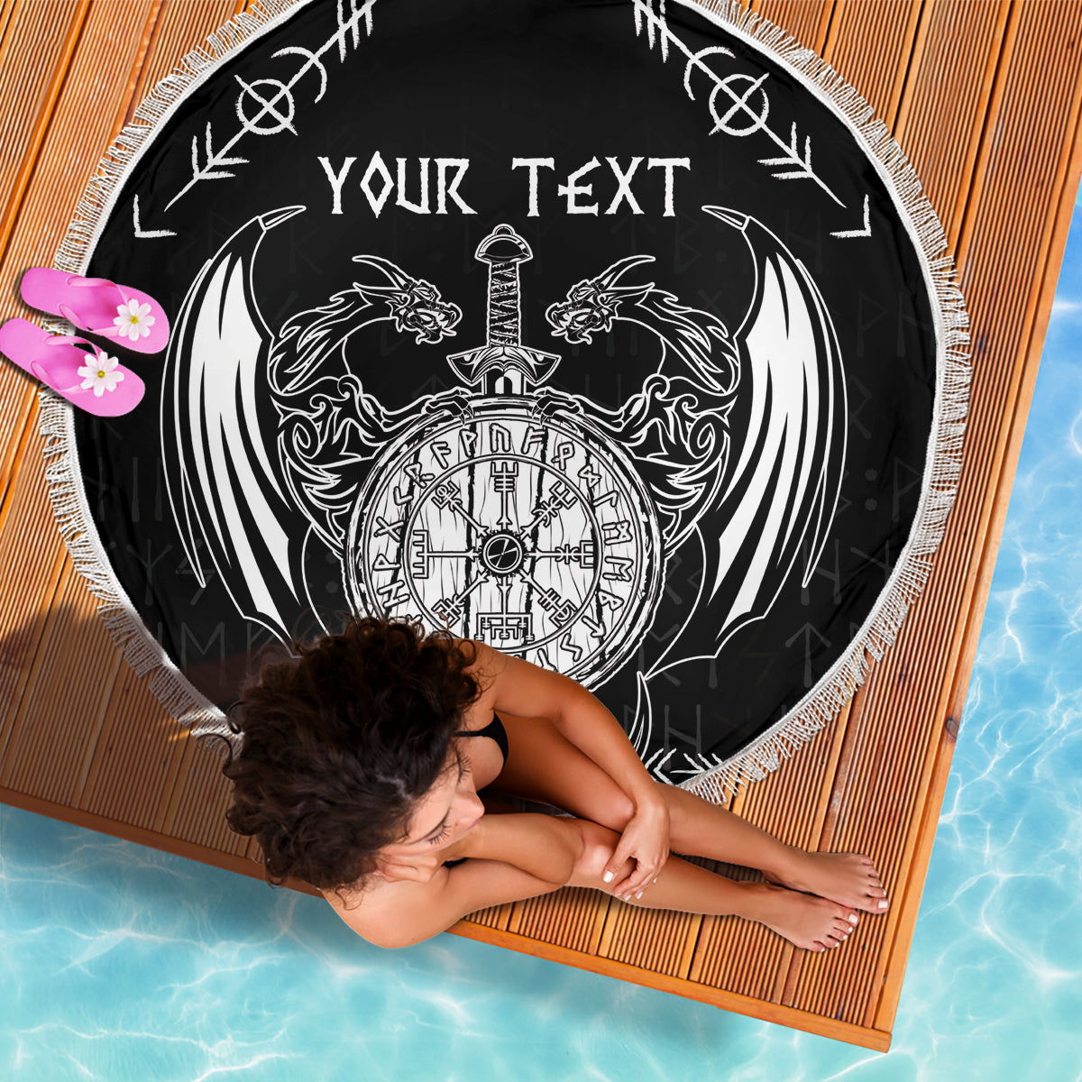 Black round beach blanket with white 'YOUR TEXT' dragon-and-sword emblem, fringed border