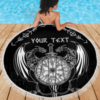 Black round beach blanket with white 'YOUR TEXT' dragon crest and sword emblem, fringed