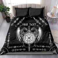 Black bedding set with white Viking compass, dragon wings, and two matching pillowcases.