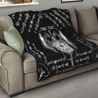 Black quilt blanket on sofa with large Viking sword-and-dragon graphic and 'YOUR TEXT'