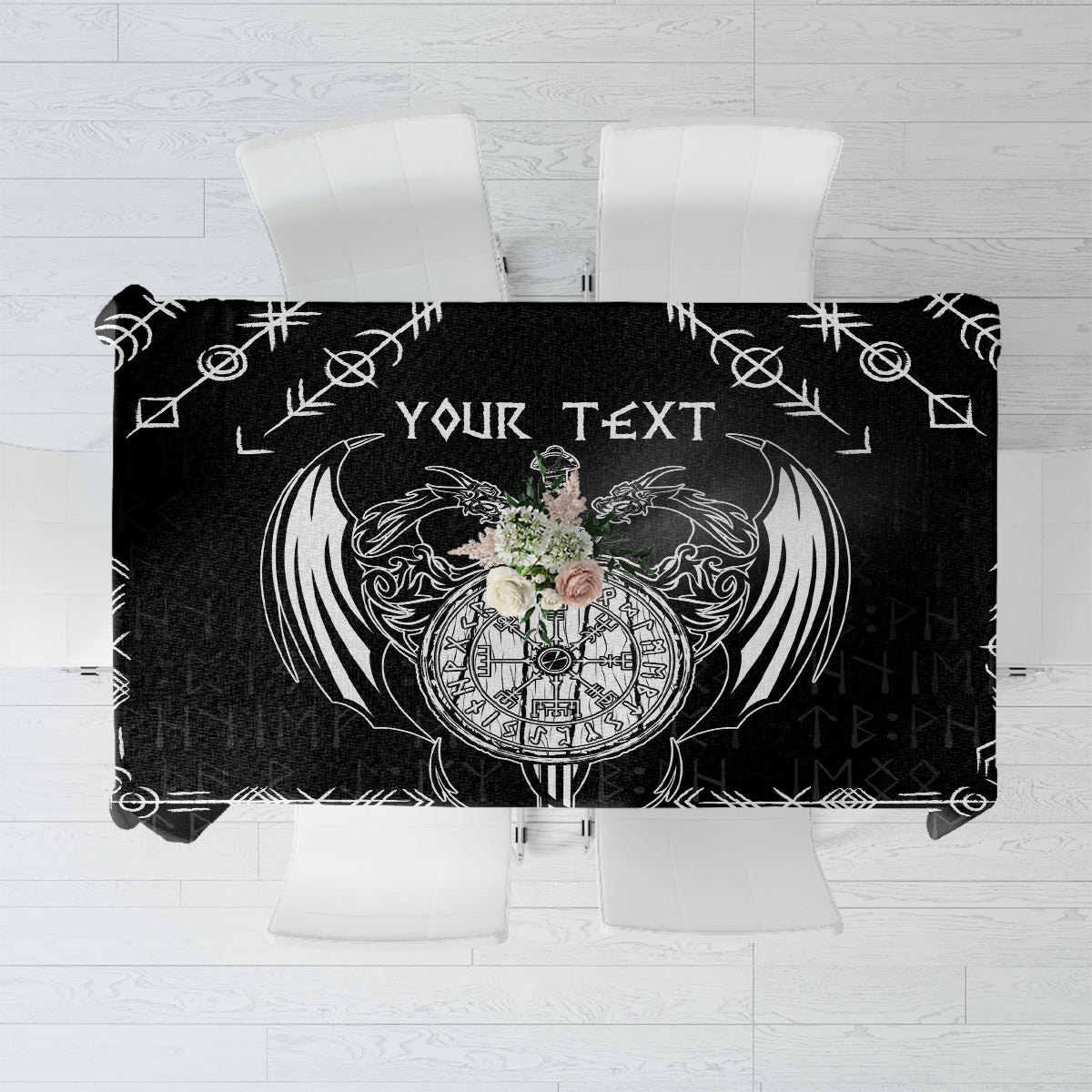 Black tablecloth with white Viking dragon and sword graphic centerpiece.