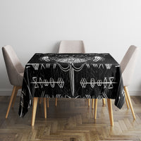Black tablecloth with white Viking symbol border design on top surface.