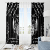 Black window curtain with white Viking dragon sword tattoo and sheer light window behind