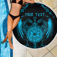 Round beach blanket with blue Viking dragon compass graphic, fringe edge, and custom text
