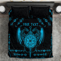Black duvet set with blue Viking dragon emblem and rune pattern, shown with two pillowcases